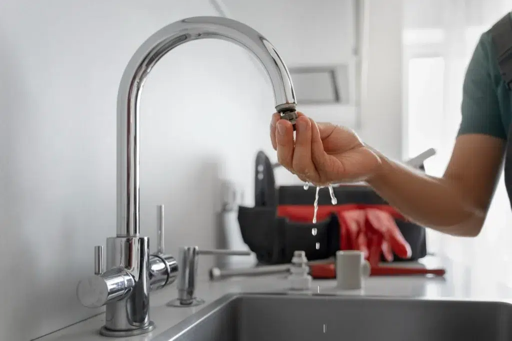 Fixing a leaky kitchen faucet.