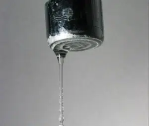 Close-up of a dripping faucet.