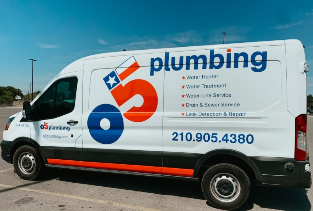 A side view of an O5 Plumbing service van, branded with the company logo and a list of plumbing services such as water heater repair, drain service, and leak detection.