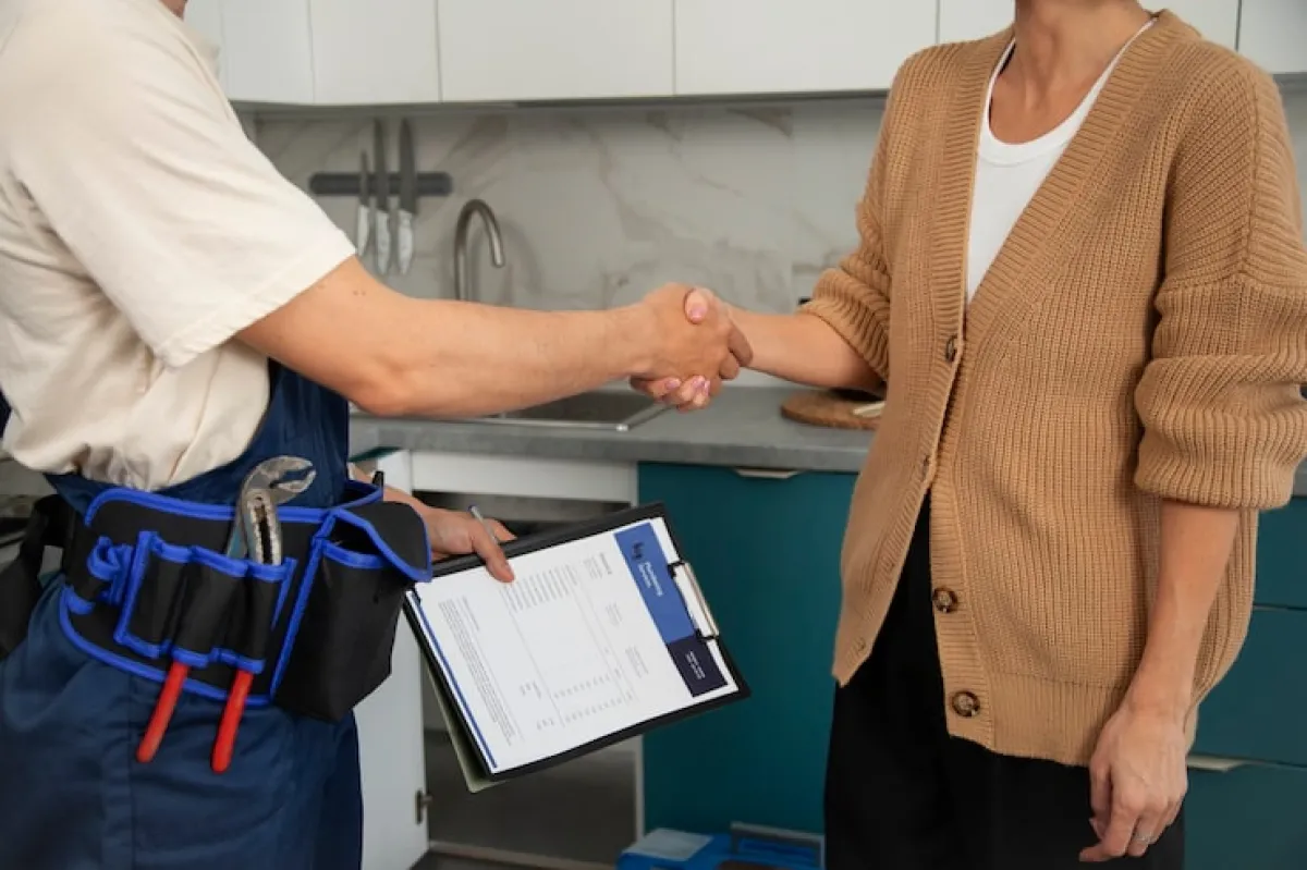 Two people shaking hands after the work